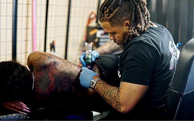 Cedric tattooing in the studio