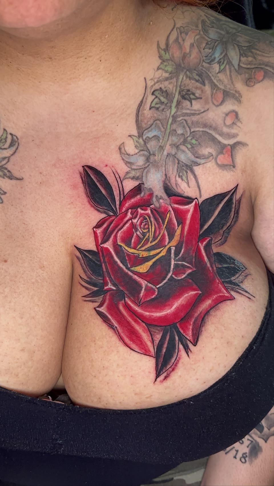 After: red rose cover-up tattoo