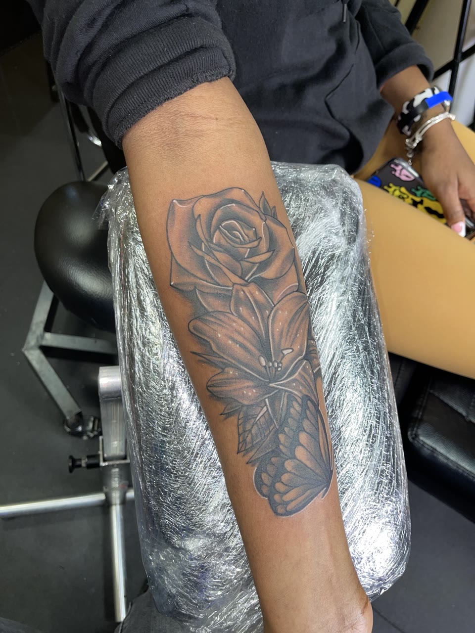 After: black and gray floral cover-up tattoo