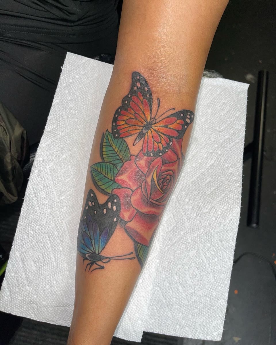 After: rose and butterfly cover-up tattoo