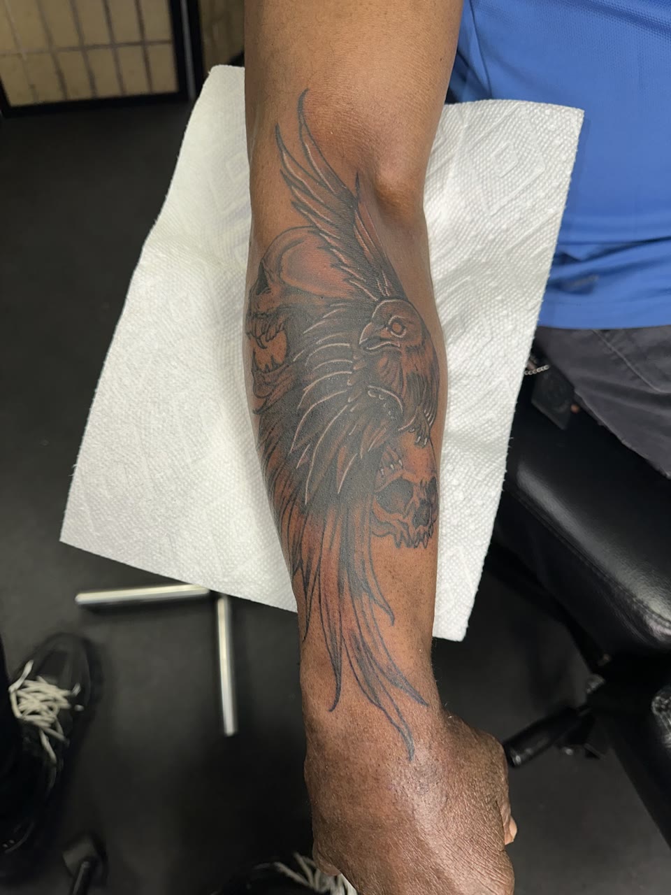 After: raven and skull cover-up tattoo