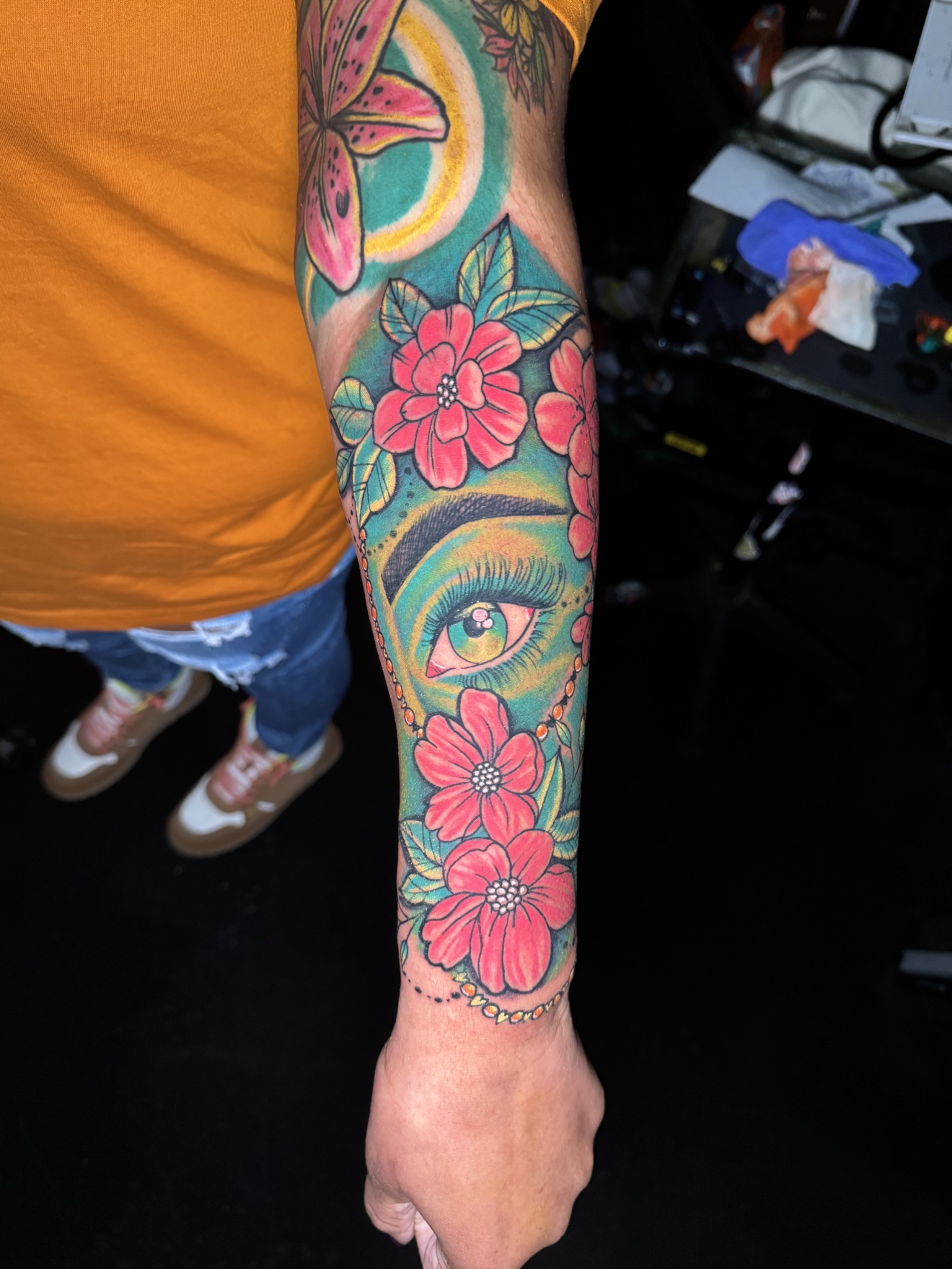 Colorful eye forearm tattoo