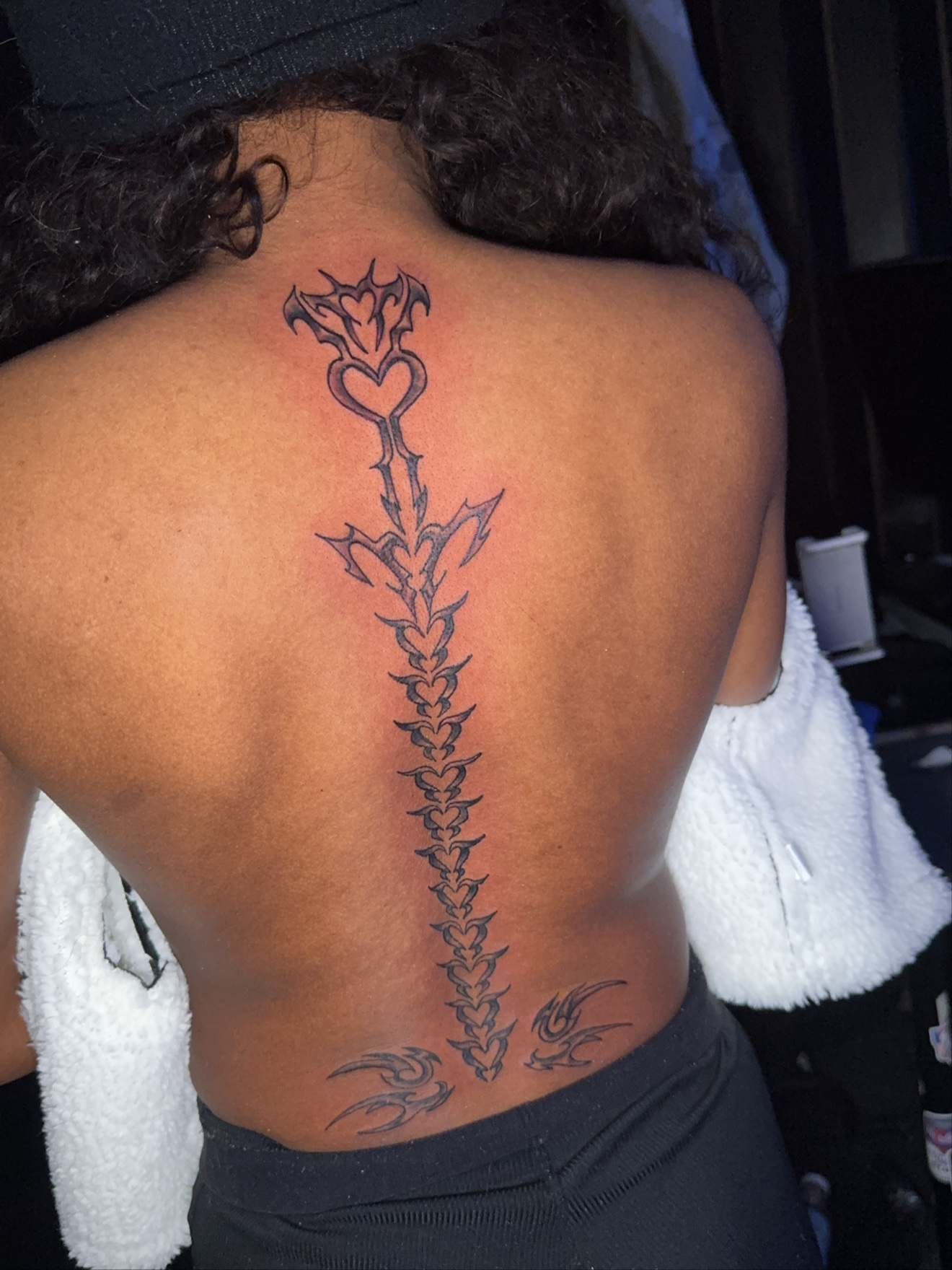 Tribal spine tattoo